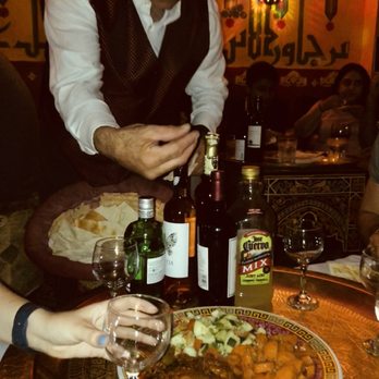 Marrakesh Restaurant - Server telling us we will love it and how to eat with pita for those who do not know - Moroccan Near Me - Philadelphia, Pennsylvania