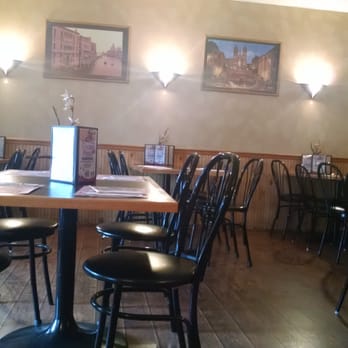 Divine Pizza - a dining room with tables and chairs - Pizza Near Me - Trenton, New Jersey