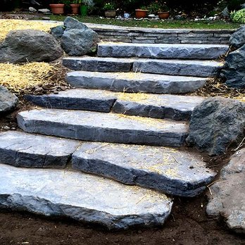 Moving Earth Excavation - a stone path leading up to a house - Landscaping Near Me - Port Townsend, Washington Moving Earth Excavation - a stone path leading up to a house - Landscaping Near Me - Port Townsend, Washington