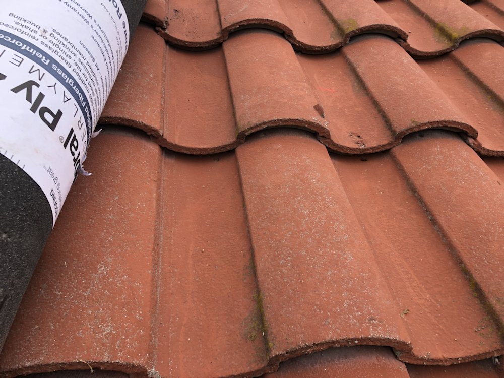 Slide of Michiel Roofing