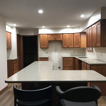 J D Coussens - a kitchen with a large island - General Contractors Near Me - Davenport, Iowa