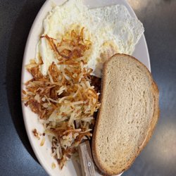The Red Arrow Diner - Two eggs, hash browns, sourdough, and ham steak.