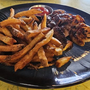 Hitchcock Station - Daily lunch special: surf and turf with steak slices, grilled shrimp and fries. - Salad Near Me - Fruitland, Idaho Hitchcock Station - Daily lunch special: surf and turf with steak slices, grilled shrimp and fries. - Salad Near Me - Fruitland, Idaho