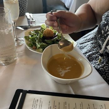 Hukilau Lanai - Lobster Curry Bisque and Local Mixed Greens with added goat cheese. - Seafood Near Me - Kapaa, Hawaii
