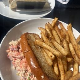 Lobster roll with fries and fish tacos
