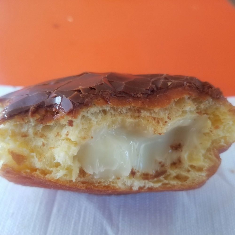 Jax Donuts - Inside the Boston Creme donut.  Didn't get any custard til half way through. - Donuts Near Me - Orange, California
