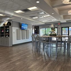 The Table - Main space when you walk in. Featuring one of the many screens and ads I mentioned in my review.