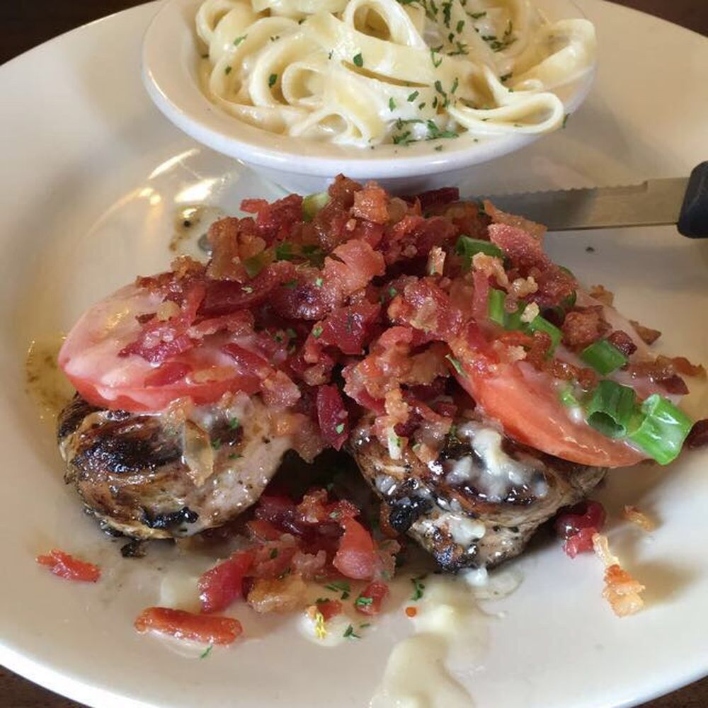 a plate of food with pasta and meat a plate of food with pasta and meat