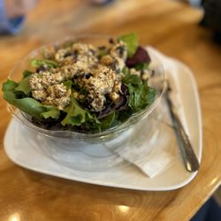 Little Owl Cafe - Best chicken salad I have ever had. It usually comes as a sandwich, but I got mine on a bed of greens.