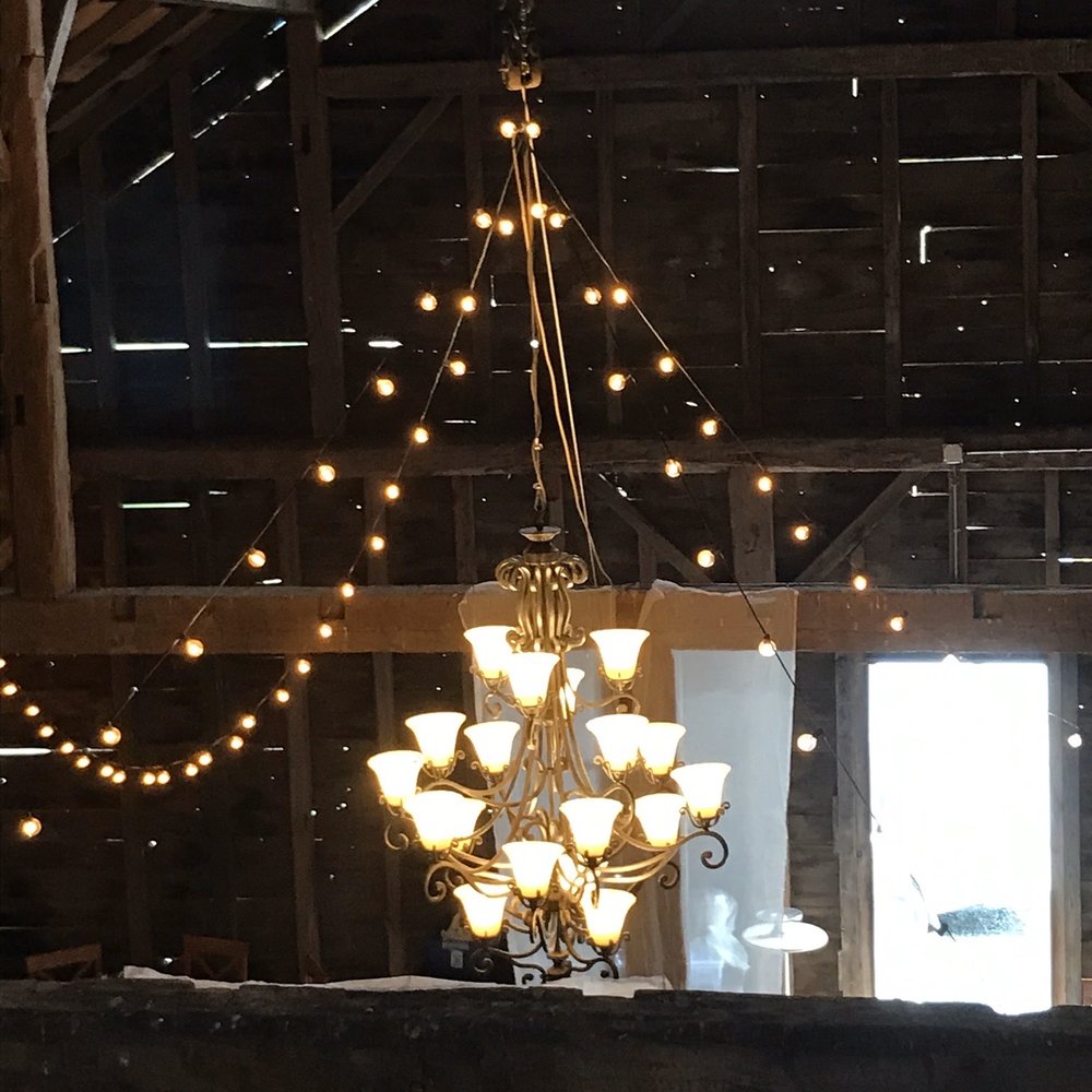 Adena Orchard - View from the loft in the event barn / chandelier and string lighting - Venues & Event Spaces Near Me - Jewett, New York