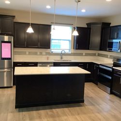Upscale Remodeling - Countertops and exterior lighting installed along with an island kitchen.