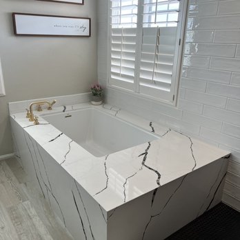 JE Stone and Tile - New quartz around bathtub. - Countertop Installation Near Me