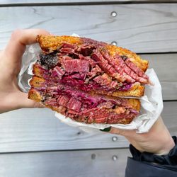 Larder Delicatessen and Bakery - Pastrami sandwich | Instagram: slimthiccarbs