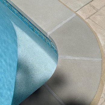 Rainbow Pool Plastering - Replastered swimmers seat in the pool. View of the coping, grout work, and Deck-o-seal. - General Contractors Near Me - Santa Clarita, California Rainbow Pool Plastering - Replastered swimmers seat in the pool. View of the coping, grout work, and Deck-o-seal. - General Contractors Near Me - Santa Clarita, California