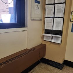 Maimonides Dental & Oral Surgery - Information pamphlets/papers on the wall of Waiting Room