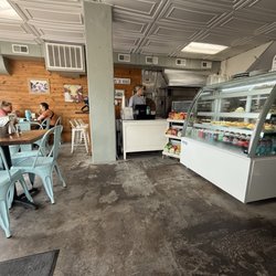 Pickled Cafe - Just inside the entry door of view of the interior seating. Also outdoor seating on picnic tables with umbrellas.