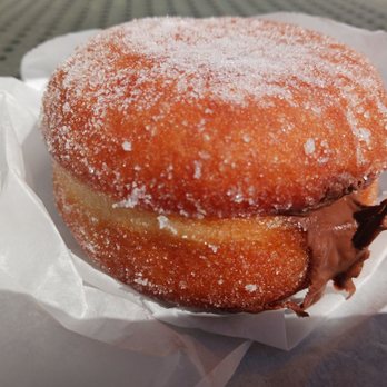 Bkedshop - a donut covered in powdered sugar - Bakeries Near Me - Mt Pleasant, South Carolina