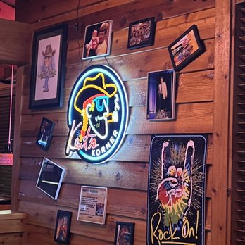 Texas Roadhouse - A neon light with many picture frames around it. - Steakhouses Near Me - Rochester, New York Texas Roadhouse - A neon light with many picture frames around it. - Steakhouses Near Me - Rochester, New York