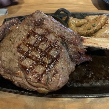 Bigfire - Cowboy ribeye; crispy smashed potatoes - American Near Me - Orlando, Florida Bigfire - Cowboy ribeye; crispy smashed potatoes - American Near Me - Orlando, Florida