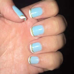 Gel French manicure with a blue base, gold line, and classic white tip. Bump free and completely smooth! Gel French manicure with a blue base, gold line, and classic white tip. Bump free and completely smooth!
