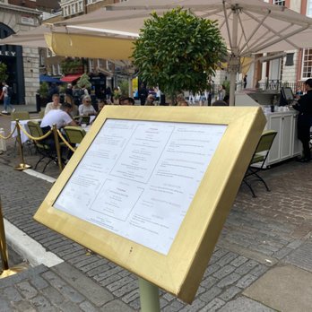 Ladurée - Outdoor seating patio, front with menu - Bakeries Near Me - London, XGL Ladurée - Outdoor seating patio, front with menu - Bakeries Near Me - London, XGL