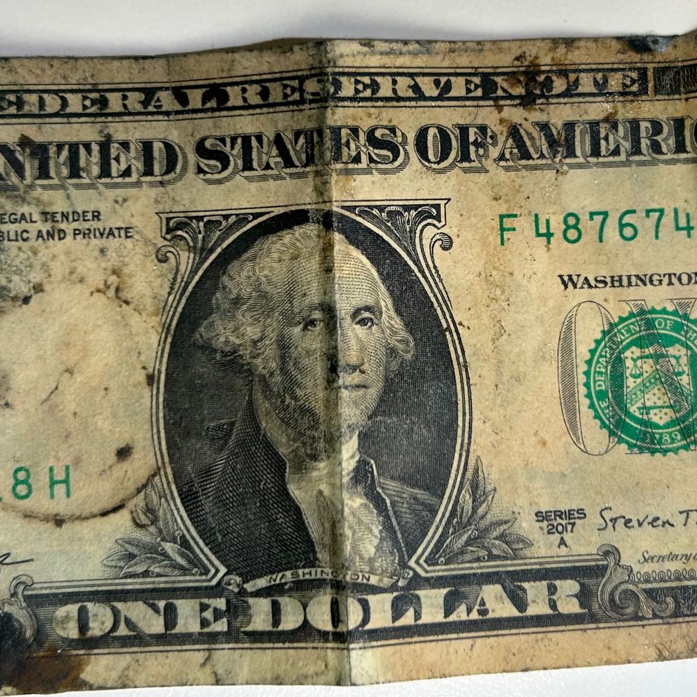 First Watch - This was the dollar that was handed to me as change from the cashier today.  It was crusty with what appeared to be food & tar material - Breakfast & Brunch Near Me - Noblesville, Indiana