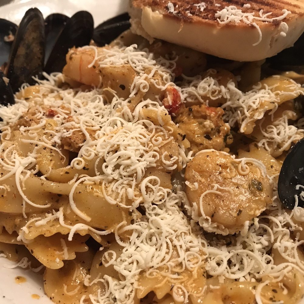 Black Spoon Bistro - Cajun seafood pasta with shredded cheese - Seafood Near Me - North Sydney, Nova Scotia