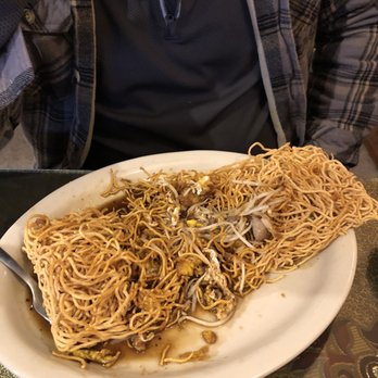 Typhoon - a plate of noodles on a table - Thai Near Me - Pittsburg, Kansas
