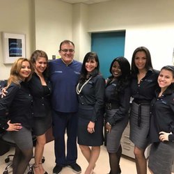 Community Smiles - The front desk staff and our Chief Dr. Dangeshiar