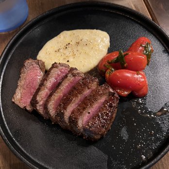 Mi Kitchen - ny strip, feta grits, soy glaze cherry tomato kimchi - Tapas Bars Near Me - Franklin, Tennessee Mi Kitchen - ny strip, feta grits, soy glaze cherry tomato kimchi - Tapas Bars Near Me - Franklin, Tennessee