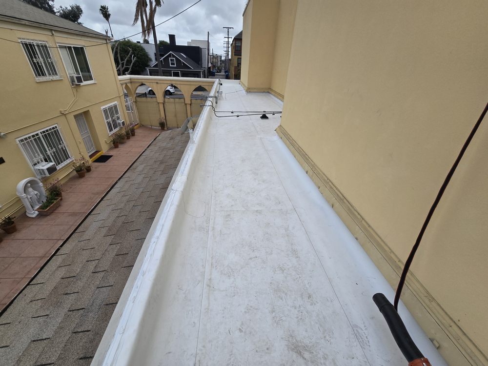 Slide of J&E Roofing Services