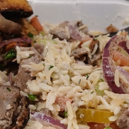 Stirred up rice bowl with chicken schwarm. Rice was not seasoned today very not yellow. Stirred up rice bowl with chicken schwarm. Rice was not seasoned today very not yellow.