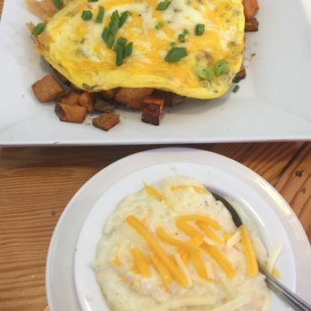The Blue Hen Cafe - Zada Janes stack with a side of cheese grits. - Southern Near Me - Saint Augustine, Florida