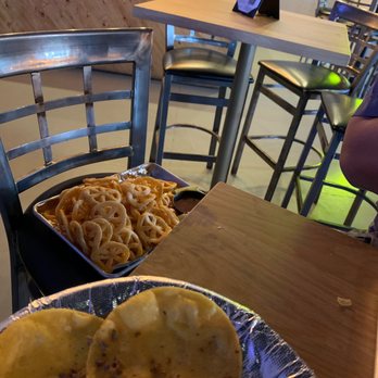Picks Bar - Our papalote doros chip tray sitting in a chair because the owner does not allow to adjust tables to accommodate . - Sports Bars Near Me - San Antonio, Texas