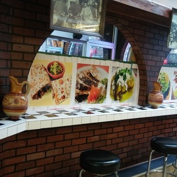Taqueria El Guero - a row of bar stools - Tacos Near Me - Chicago, Illinois Taqueria El Guero - a row of bar stools - Tacos Near Me - Chicago, Illinois