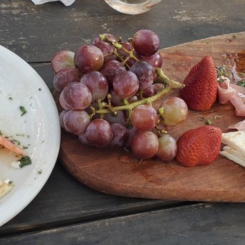 Opa! Greek Cafe - Baked feta and cheese plate (partially eaten on both - whoops!) - Wine Bars Near Me - Austin, Texas Opa! Greek Cafe - Baked feta and cheese plate (partially eaten on both - whoops!) - Wine Bars Near Me - Austin, Texas