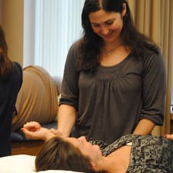 Blue Hills Sports & Spine Rehabilitation - Christine Donadio, MSPT working with a patient at Blue Hills Sports & Spine Rehabilitation's Weymouth Office