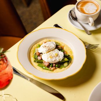 Nizza - Creamy Polenta & Eggs: 2 poached or scrambled eggs, fonduta, spring vegetable & prosciutto stufato, grana - Italian Near Me - New York, New York Nizza - Creamy Polenta & Eggs: 2 poached or scrambled eggs, fonduta, spring vegetable & prosciutto stufato, grana - Italian Near Me - New York, New York