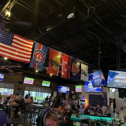 Pelican Harry's Bar & Grill - The flags hung above the bar