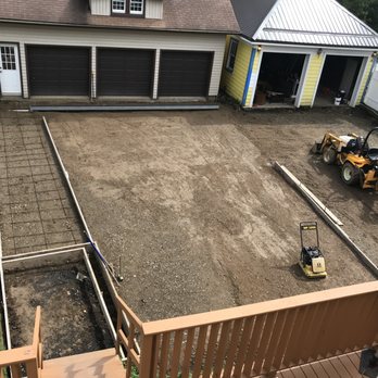 Jon Neudeck Concrete - Subbase material laid down and compacted, rebar being installed along with forms and driveway trench drain. - Masonry/Concrete Near Me Jon Neudeck Concrete - Subbase material laid down and compacted, rebar being installed along with forms and driveway trench drain. - Masonry/Concrete Near Me