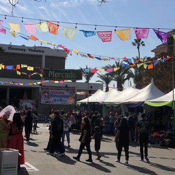 Downey Theatre - a crowd of people walking through a plaza - Performing Arts Near Me - Downey, California