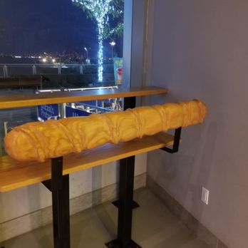 Bake Culture - "Bread" chair with view of outdoor decorations and Manhattan skyline from afar. - Bubble Tea Near Me - Staten Island, New York Bake Culture - "Bread" chair with view of outdoor decorations and Manhattan skyline from afar. - Bubble Tea Near Me - Staten Island, New York