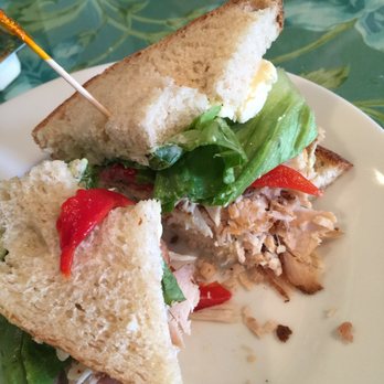 Simply Delicious - Turkey sandwich with 2 bites out of it. - Caterers Near Me - Flagstaff, Arizona