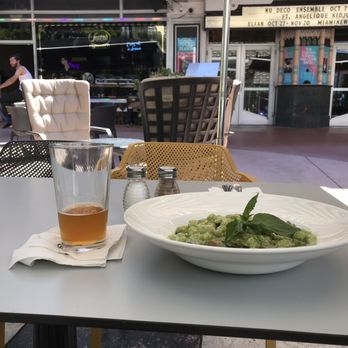 Segafredo L'Originale - A perspective of the alfresco seating arrangement. Gnocchi pasta with pesto, chicken, mushrooms, and bell pepper. Bon appetit - Italian Near Me - Miami Beach, Florida Segafredo L'Originale - A perspective of the alfresco seating arrangement. Gnocchi pasta with pesto, chicken, mushrooms, and bell pepper. Bon appetit - Italian Near Me - Miami Beach, Florida
