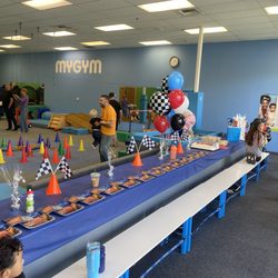 My Gym - They set up the plates, napkins, and balloons. We brought a few centerpieces to add a little extra flair!