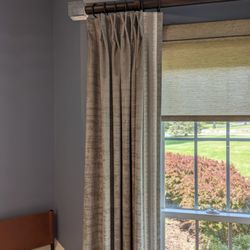 Timber Springs Drapery Co - Monarch pleat drapery panel with decorative hardware and roller shade.