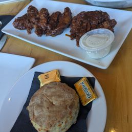 Tenders in Jamaican jerk sauce and a biscuit Tenders in Jamaican jerk sauce and a biscuit