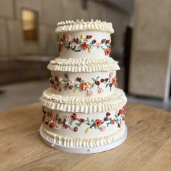 Ruffled edges wedding cake with tiny floral details by Whipped Bakeshop in Philadelphia
