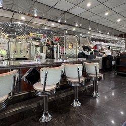 Gleaming counter with stools