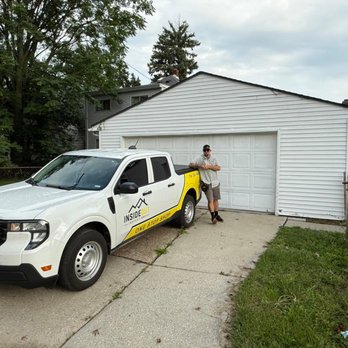 Insideout Inspections - Home inspector leaning against a white "Inside Out Inspections" company pickup truck parked in a driveway. - Home Inspectors Near Me - Ottawa Lake, Michigan Insideout Inspections - Home inspector leaning against a white "Inside Out Inspections" company pickup truck parked in a driveway. - Home Inspectors Near Me - Ottawa Lake, Michigan